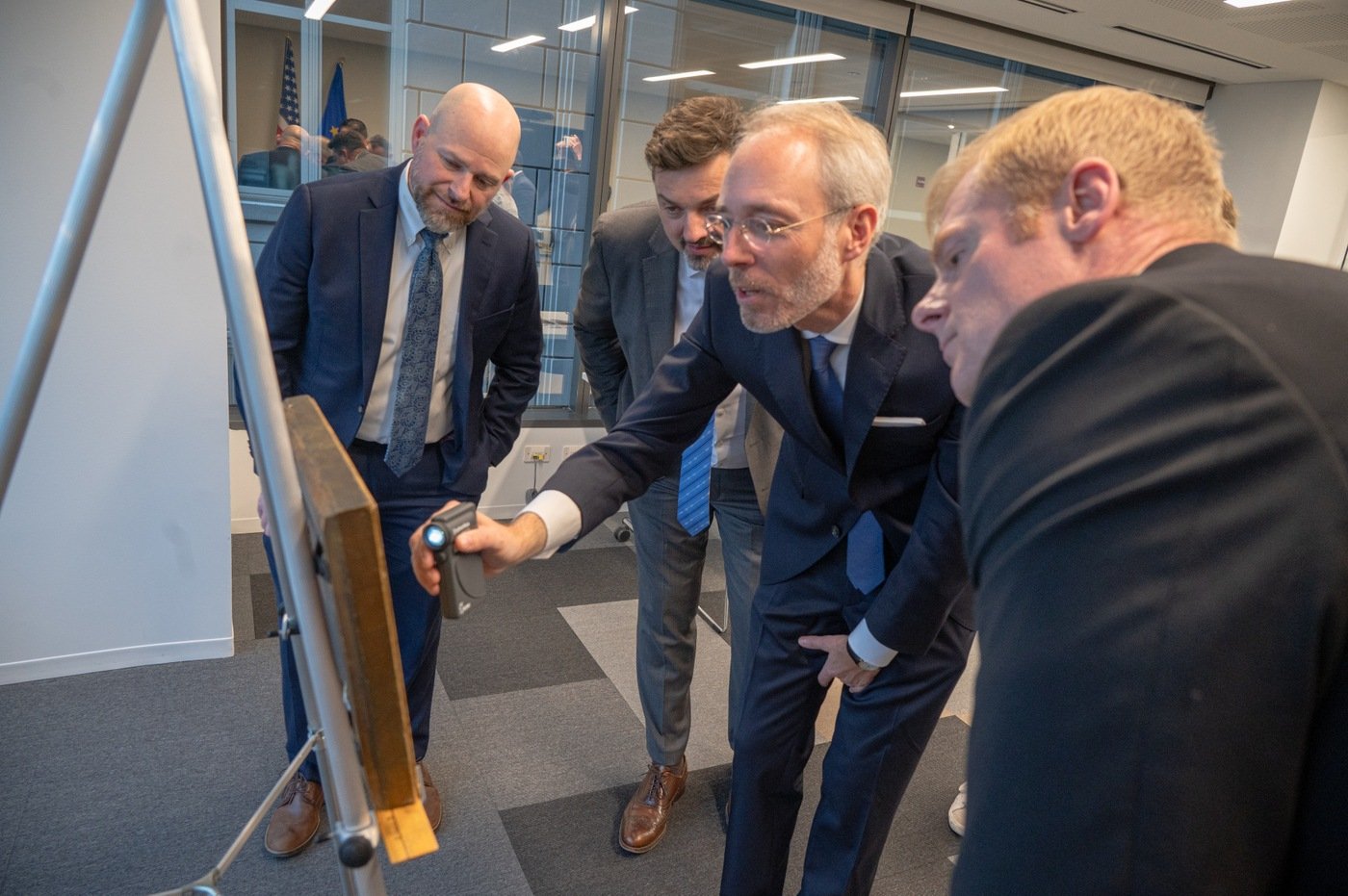 From left: FBI Chicago Assistant Special Agent in Charge Eric Shiffman; German Consul General Michael Ahrens; Dr. Bernd Ebert, head of the Dutch and German Baroque Painting Collections at the Alte Pinakothek museum; and and FBI Chicago Special Agent Benjamin Milligan examine the painting "Landschaft italienischen Charakters" (or "Landscape of Italian Character") by the Austrian painter Johann Franz Nepomuk Lauterer at the Consulate General of the Federal Republic of Germany in Chicago on October 19, 2023.

That day, the FBI’s Art Crime Team in Chicago returned the painting to its rightful owner during a ceremony at the consulate.