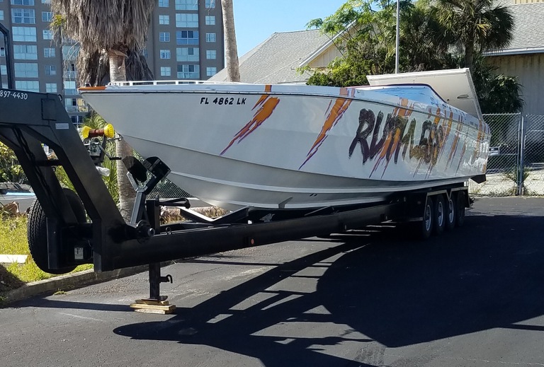 A white Cigarette racing boat with orange lightning bolts and the word Ruthless written on the side was among the assets seized from Nicholas Borgesano, Jr., in connection with his $100 million compounding pharmacy fraud scheme.