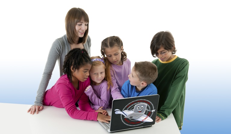 Kids gathered around a laptop for the Safe Online Surfing Internet Challenge.