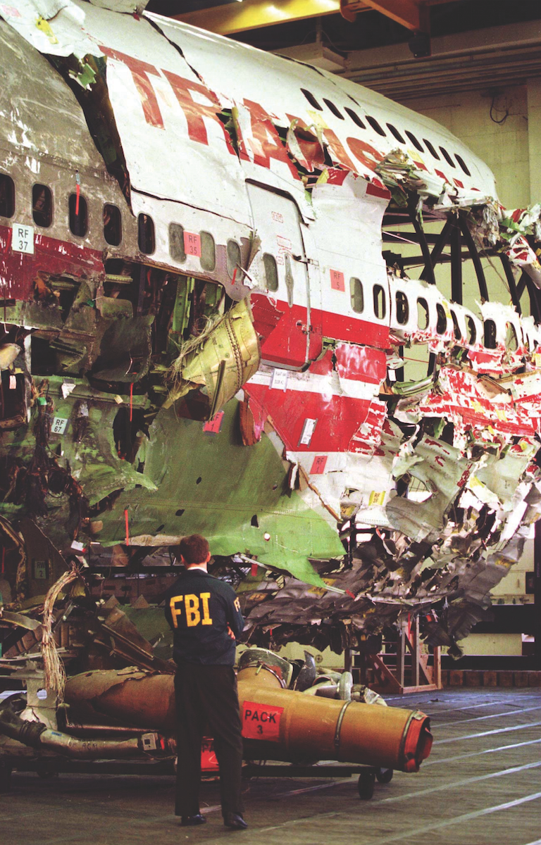 The mysterious mid-air explosion of TWA Flight 800 some nine miles off Long Island in July 1996 led to a long and difficult investigation. The FBI’s scuba team in New York helped scour a 40-square-mile patch of the ocean floor, recovering the remains of all 230 victims and over 95 percent of the airplane. Terrorism was initially suspected as the source of the explosion, and despite a raft of speculation, a massive, 17-month investigation by the FBI’s Joint Terrorism Task Force and the National Transportation Safety Board concluded that the explosion was caused by mechanical failure. Here, an FBI agent stands next to the reconstructed plane in a Navy hangar. Reuters.